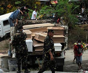 philippine-storm-floods-coffins-dead-afp-lg.jpg